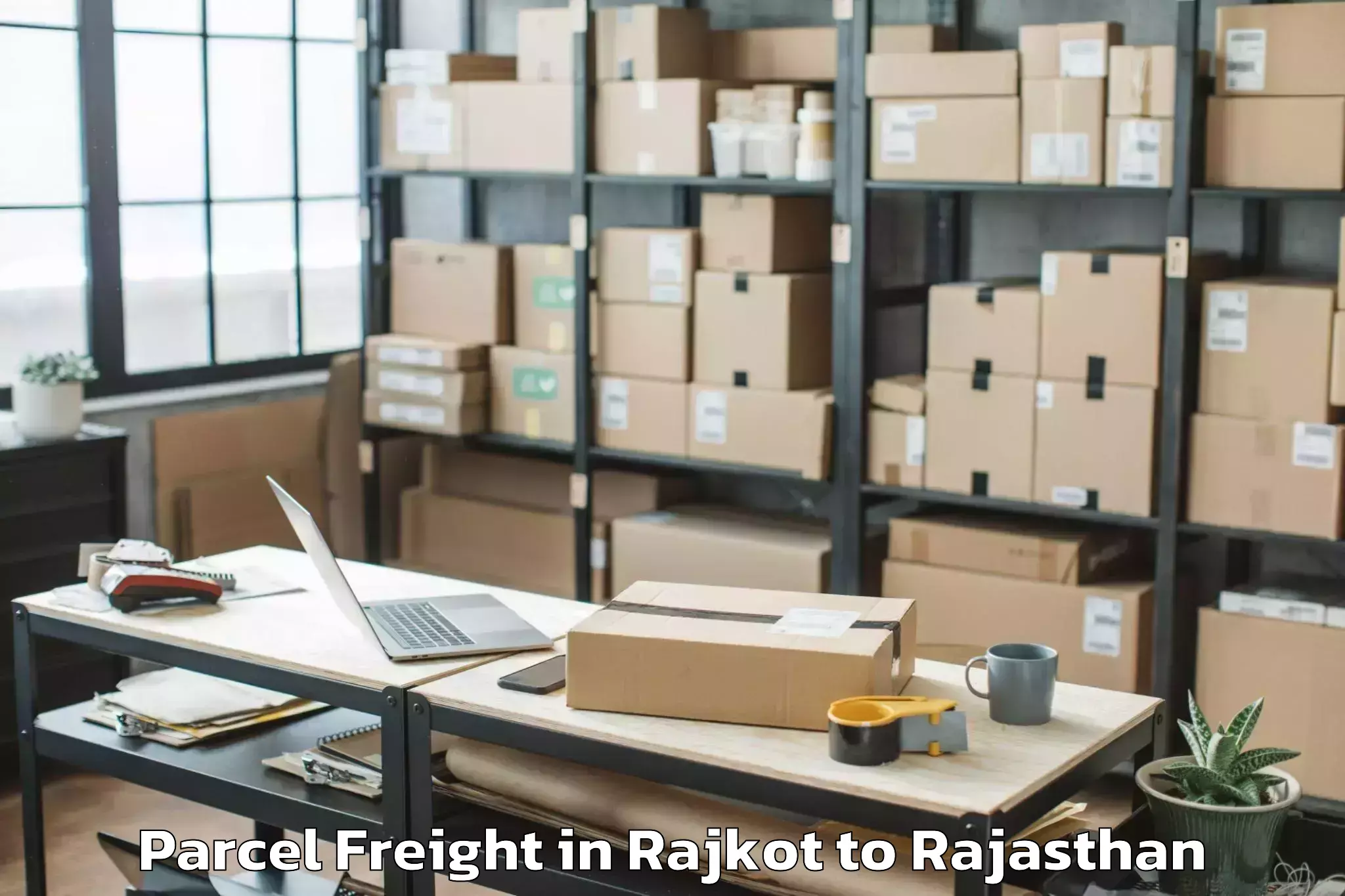 Professional Rajkot to Salumbar Parcel Freight